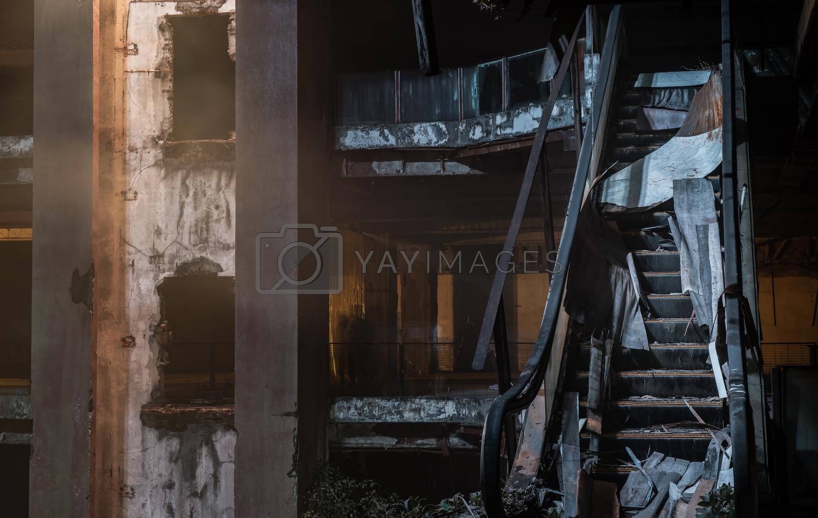 Damaged escalator in abandoned shopping mall building. Structural and ruins was left to deteriorate over time, New World Mall, Selective focus.