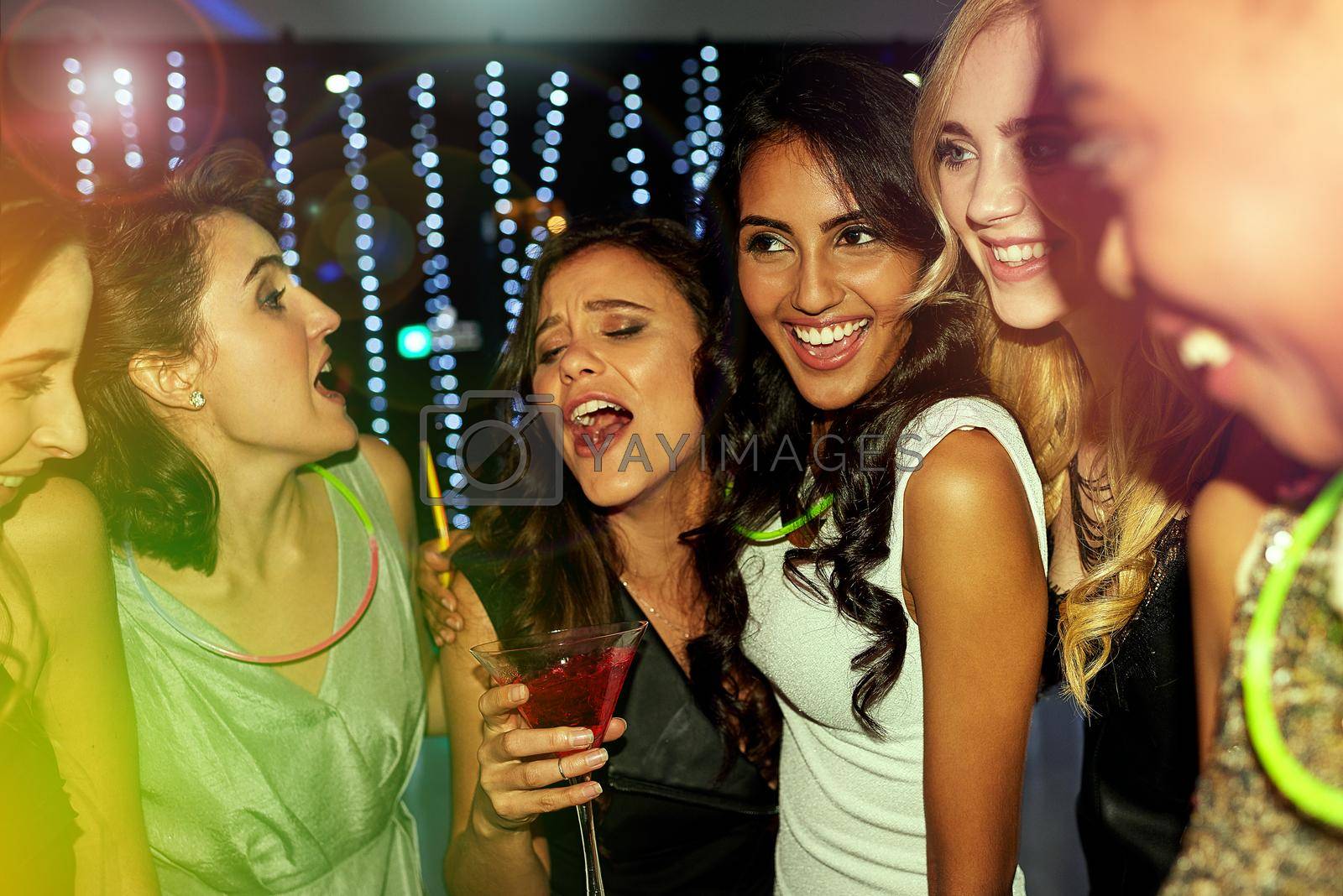 Shot of a group of young people enjoying themselves at a nightclub.