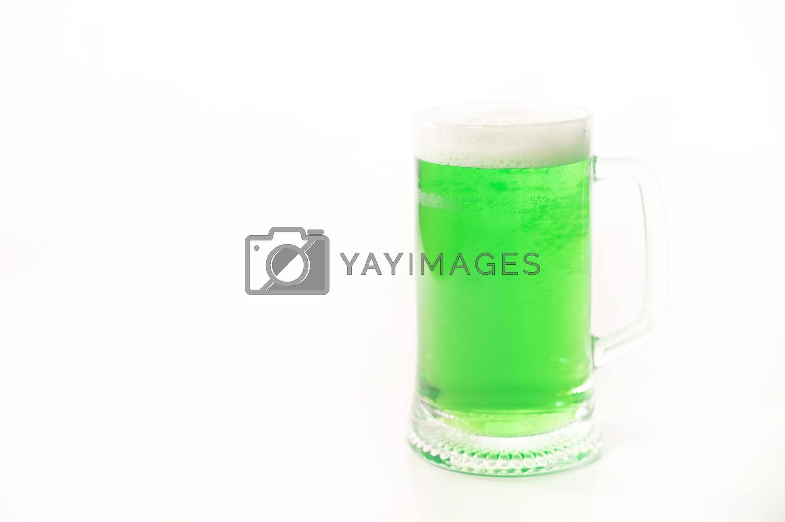 Royalty free image of A pint of green beer for st patrick's day on a white background. Traditional Irish drink for a holiday. Copy space by mrwed54