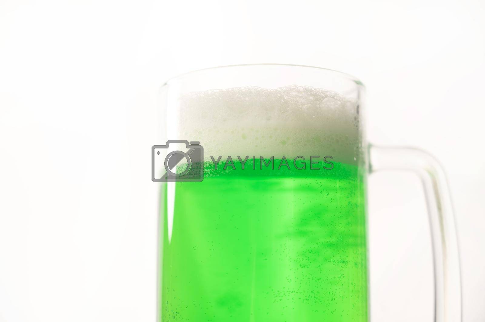 A pint of green beer for st patrick's day on a white background. Traditional Irish drink for a holiday.