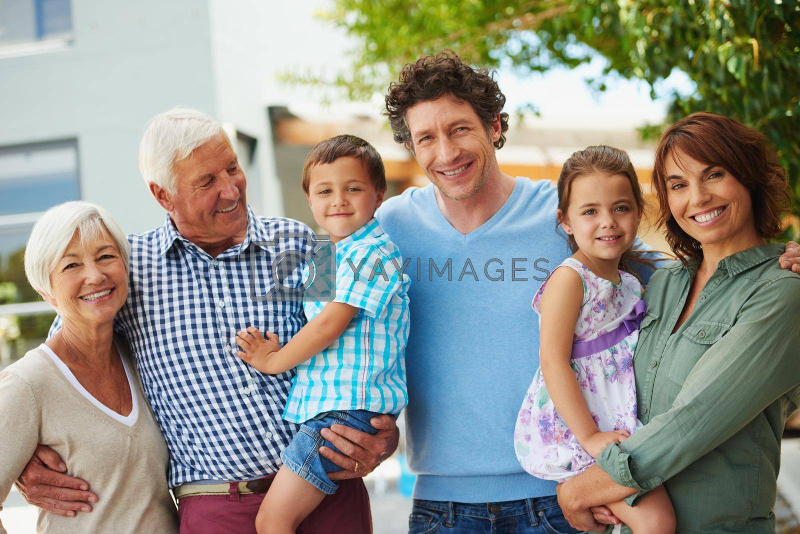 Shot of a happy multi-generational family standing together outside.