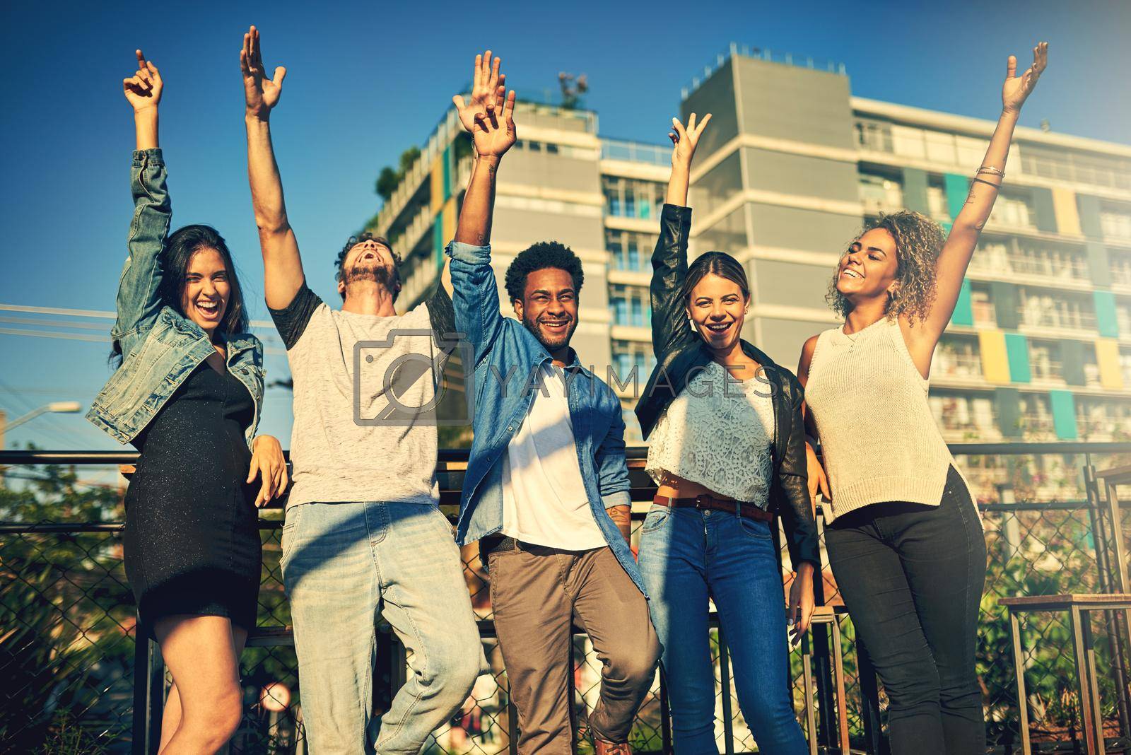 Cropped shot of a group of young diverse friends spending the day outside on a rooftop.