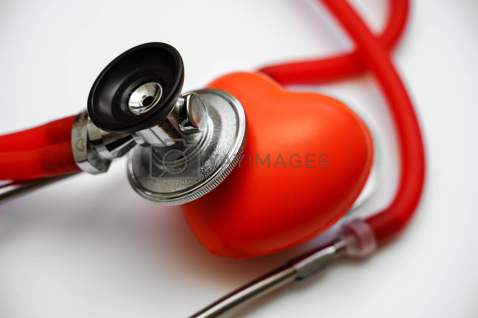 Royalty free image of Stethoscope and red heart on white background, heart health, health insurance concept by Matiunina