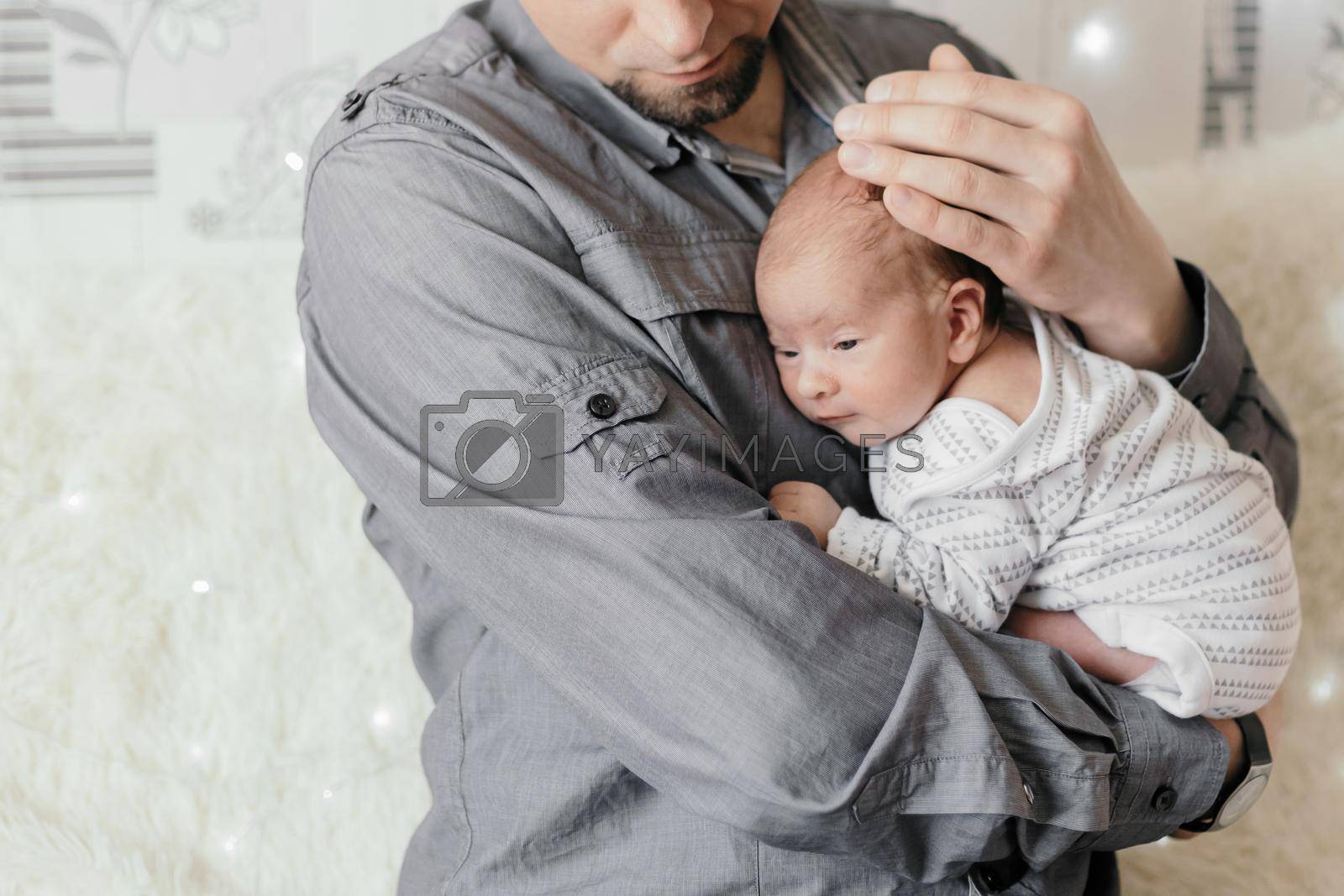 happy father with his newborn son in his arms. concept of family happiness.