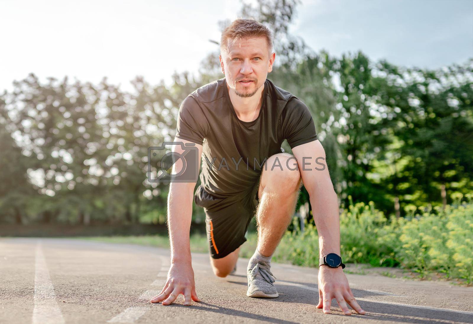 Royalty free image of Man doing workout outdoors by tan4ikk1