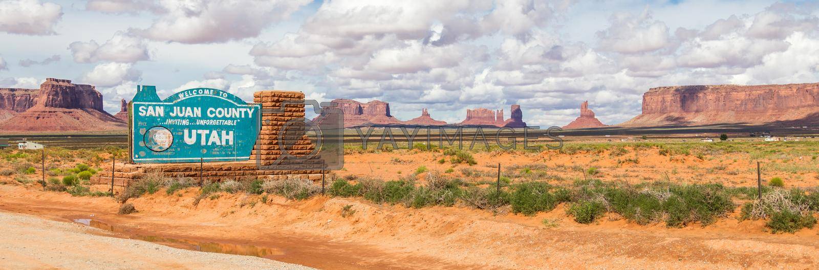 Royalty free image of Welcome sign in desert for San Juan County in Monument Valley in Utah. by Mariakray