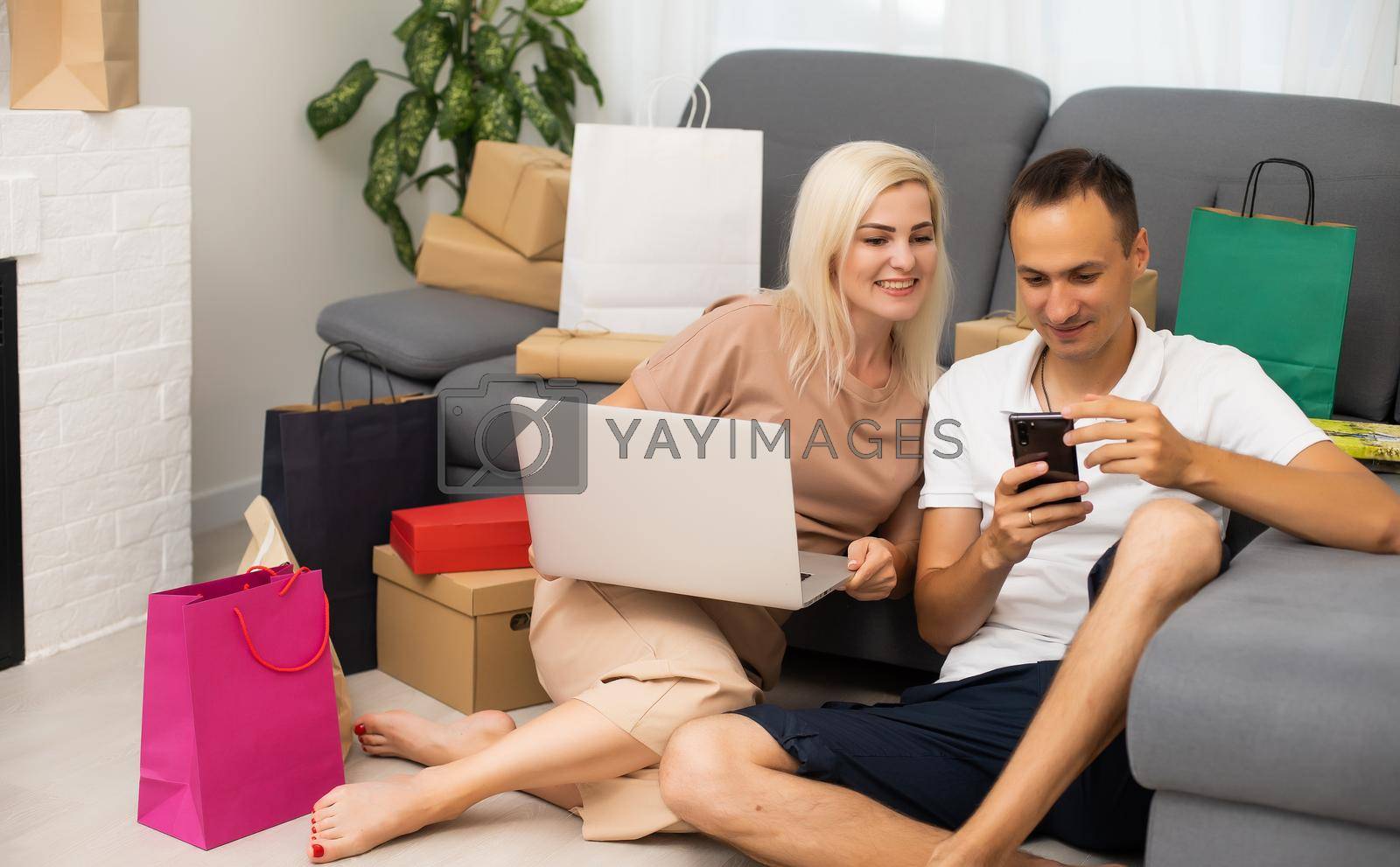 Royalty free image of Young couple shopping online with laptop. by Andelov13