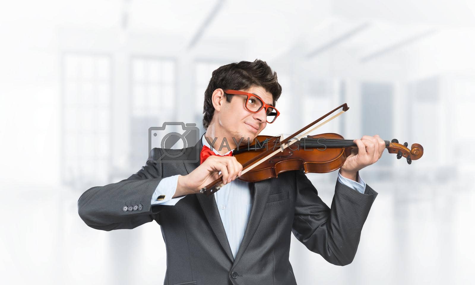 Royalty free image of young musician plays the violin by adam121