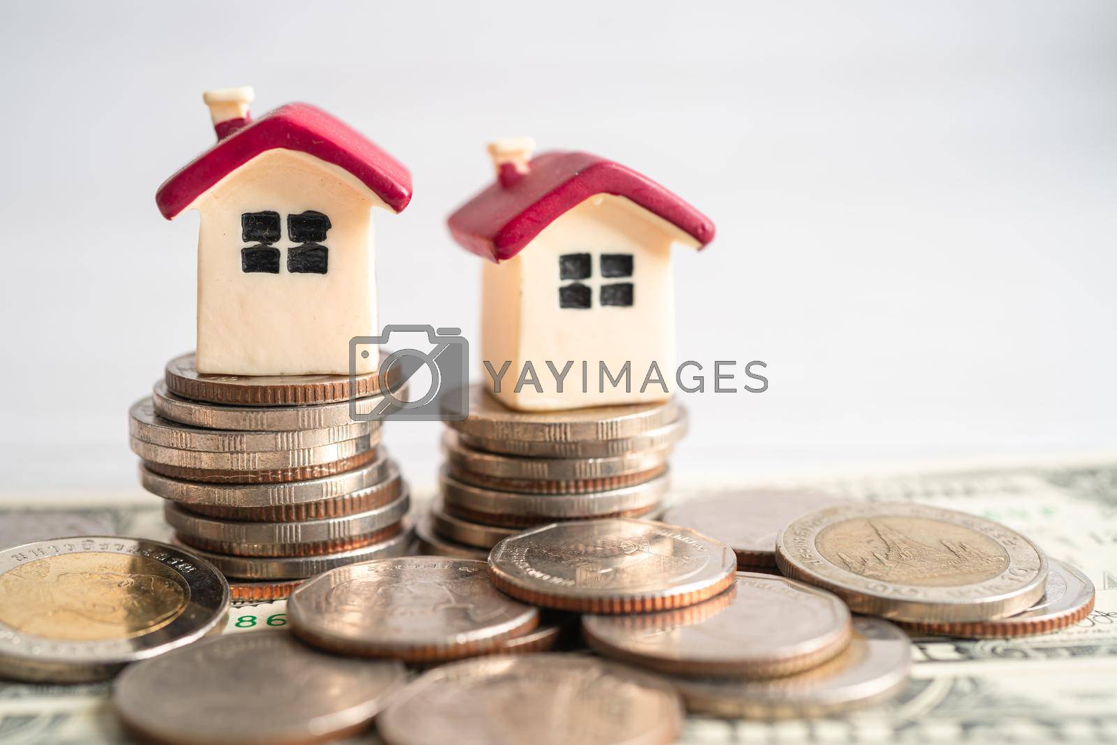 Royalty free image of House on stack coins, mortgage home loan finance concept. by pamai