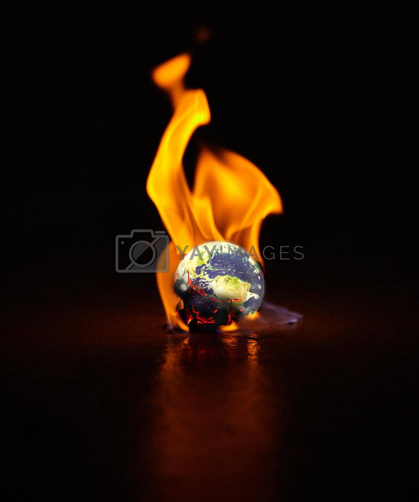 Royalty free image of If I destroy you, I destroy myself. Shot of the earth engulfed in flames against a black background. by YuriArcurs