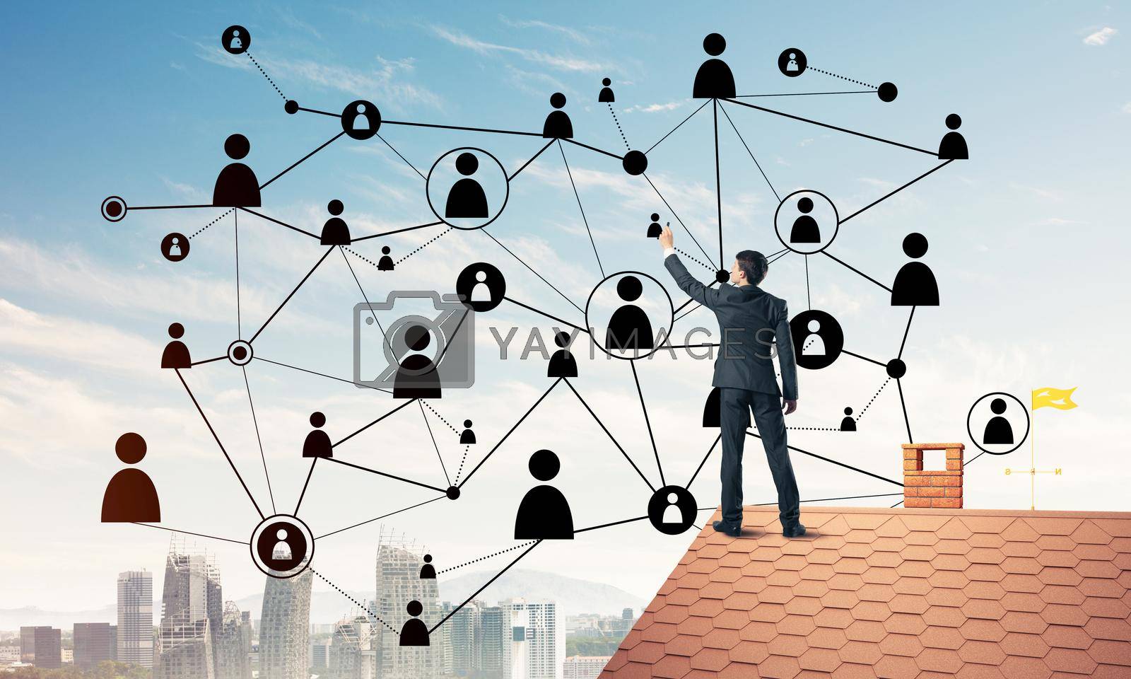 Royalty free image of Businessman on house roof presenting networking and connection c by adam121