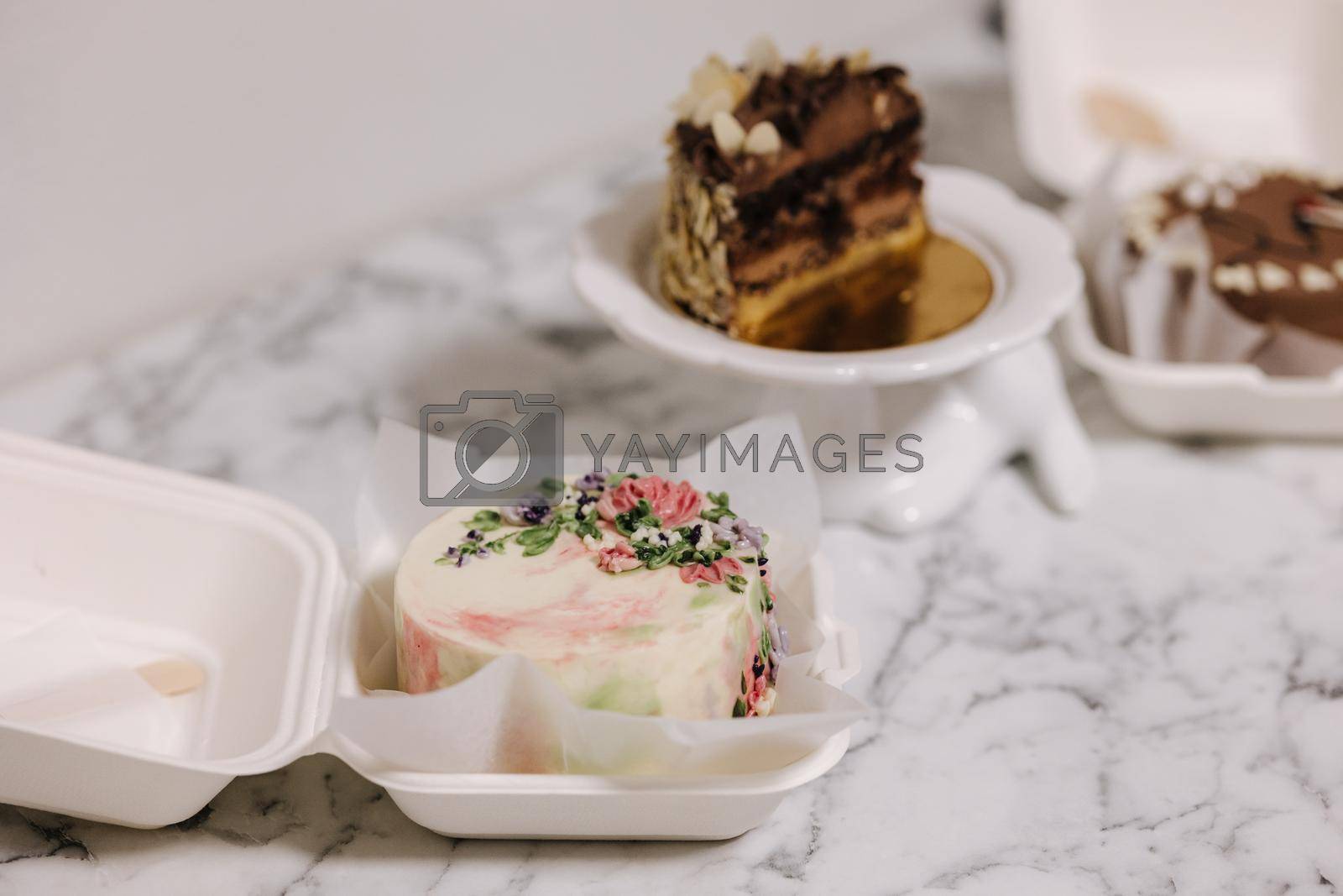 Royalty free image of Three different bento cake on white table. Small bento cake for one person as a gift for the holiday by Gritsiv