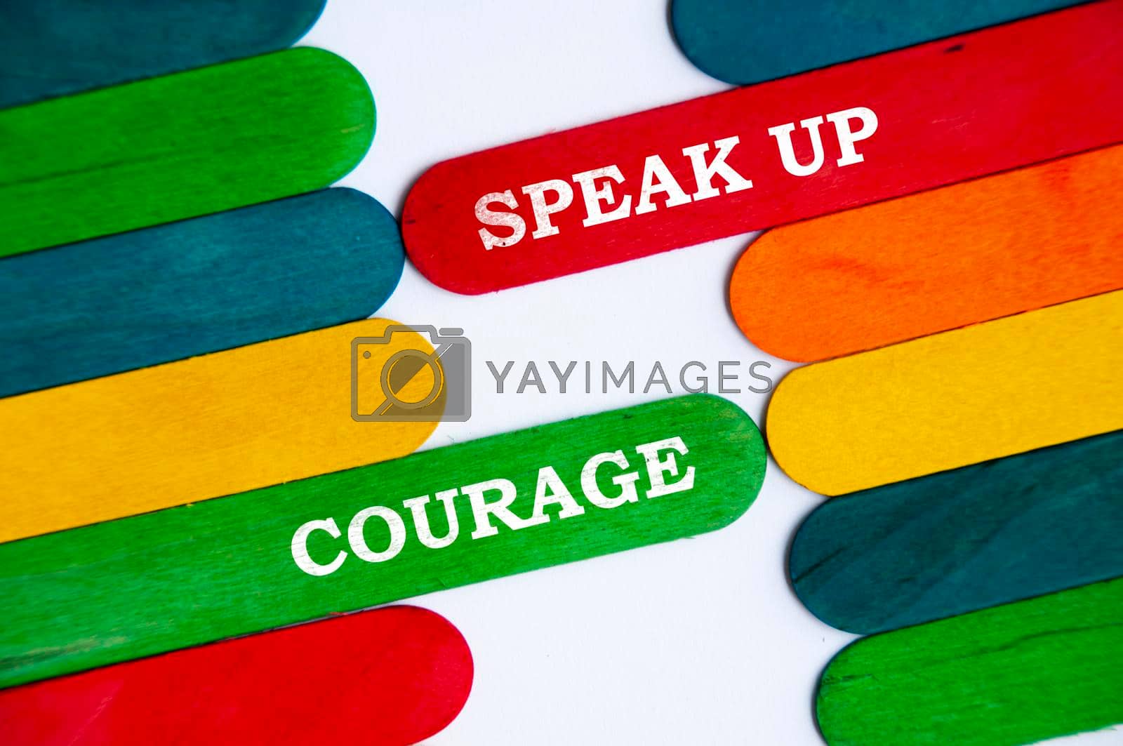 Royalty free image of Speak up and courage text on colorful wooden stick. Conceptual by yom98