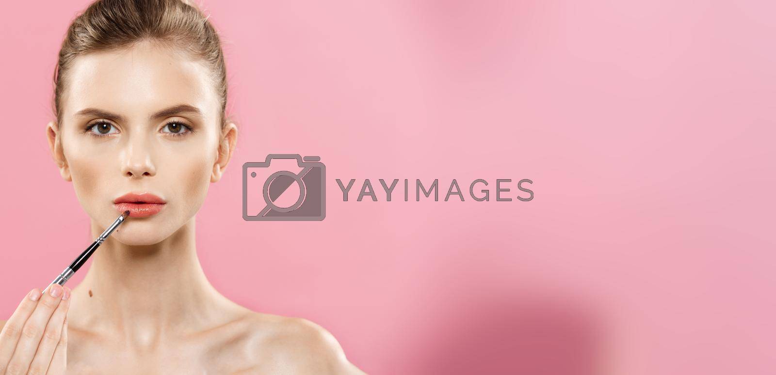 Beauty Concept - Close up Portrait of attractive caucasian girl with beauty natural skin isolated on pink background with copy space