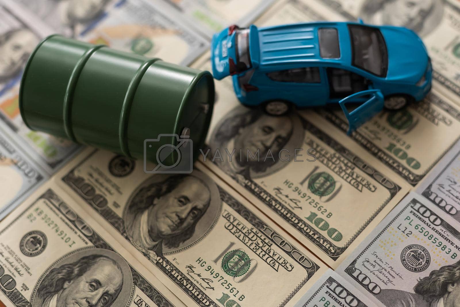 Royalty free image of the barrel of oil of one hundred US dollar bills by Andelov13