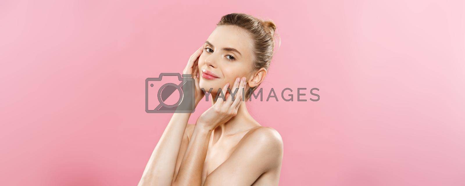 Beauty skin Concept - Beautiful Young Caucasian Woman with Clean Fresh Skin look away with pink studio background. Girl beauty face care. Facial treatment. Cosmetology.