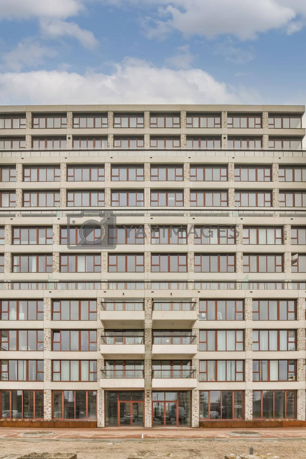 Royalty free image of Front view of a residential multi-storey building by casamedia