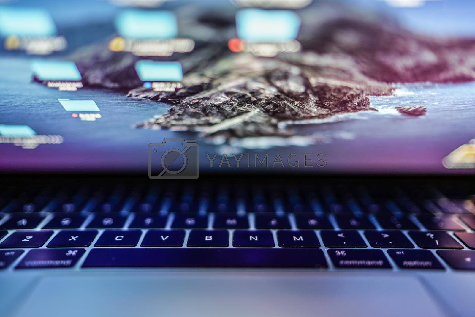 Royalty free image of Blue Glowing Laptop Keyboard Image by kanzilyou