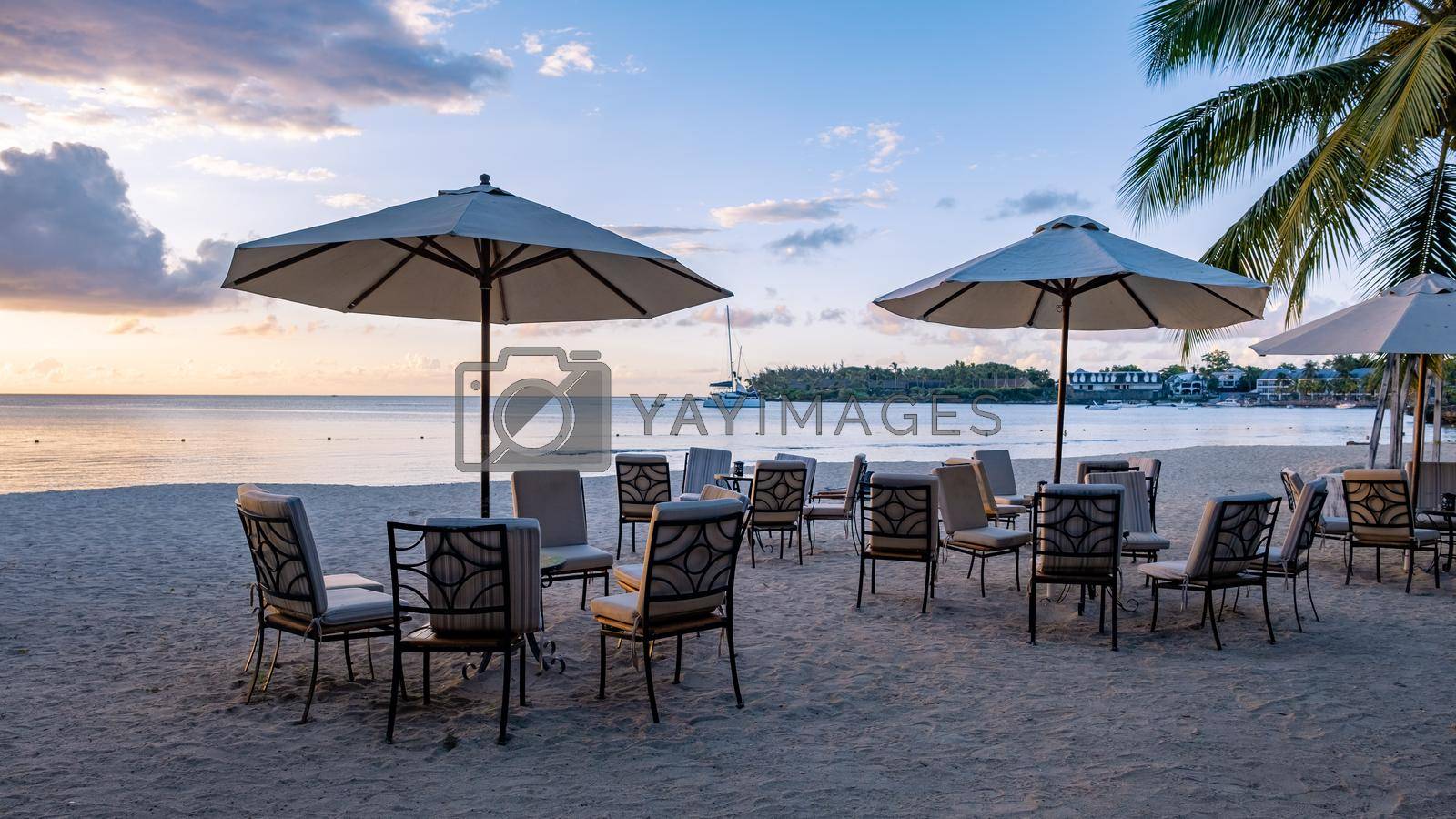 Royalty free image of luxury travel, romantic beach getaway holidays for honeymoon couple, tropical vacation in luxurious hotel, beach chairs on the beach by fokkebok