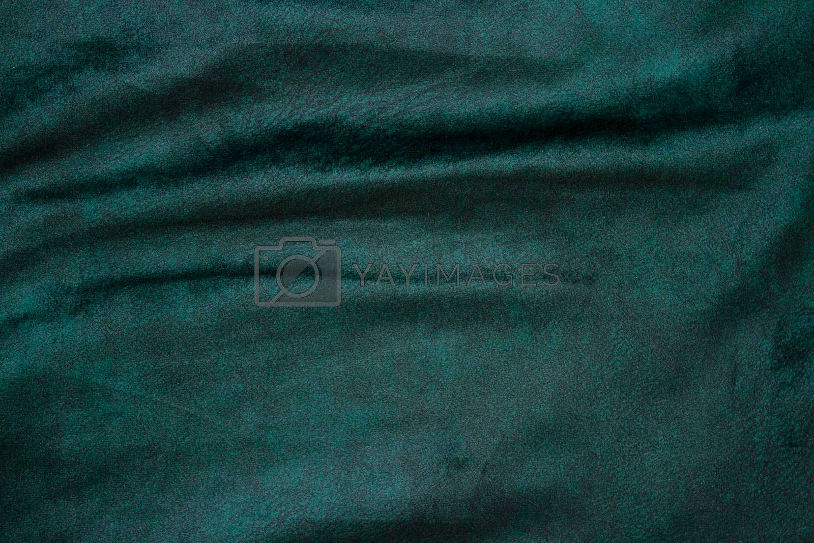 Royalty free image of velour fabric texture, background, green. Velvet velour cloth background with glowing light and dark shadows. Background for theater and fashion design themes by Hitachin