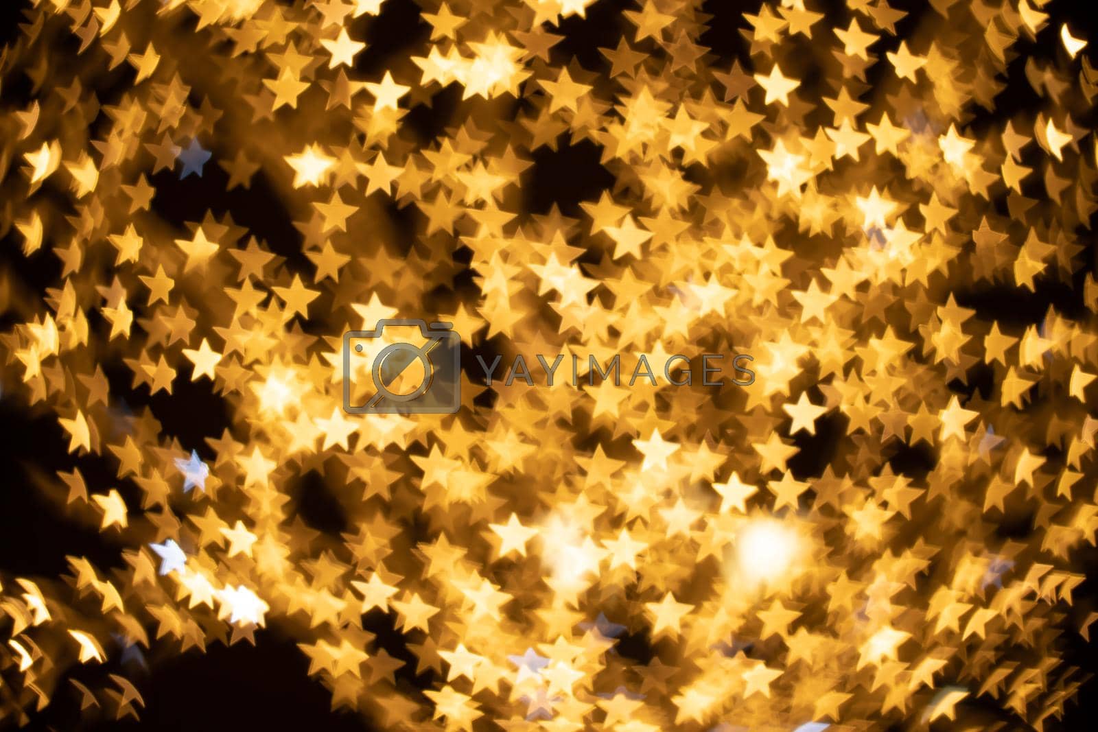 Royalty free image of Christmas ilumination bokeh gights in the city by Matiunina