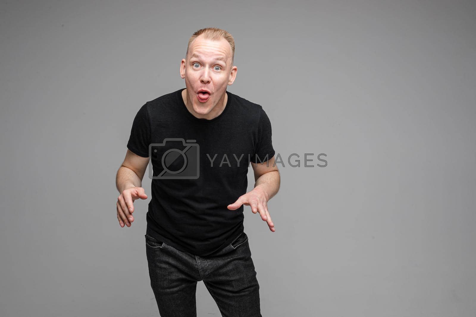 Royalty free image of Confused Caucasian man with outstretched arms. by StudioLucky