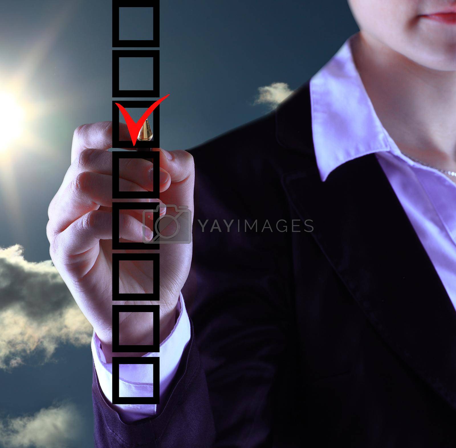 Royalty free image of business woman hand choose check mark on box by SmartPhotoLab