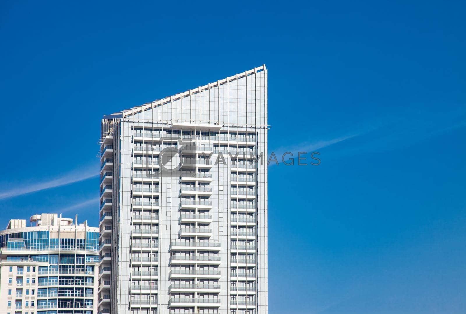 Royalty free image of Urban Building Scyscraper Top on Blue Sky by kisika