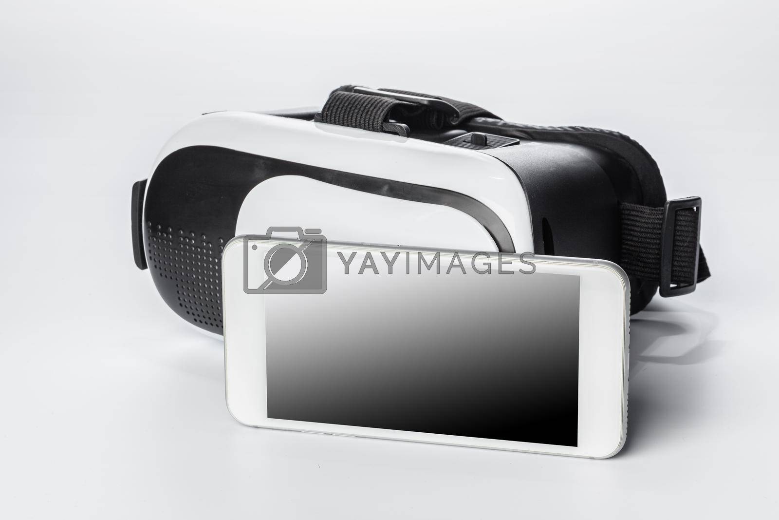 Royalty free image of VR Glasses and smartphone isolated on white background. by Fabrikasimf