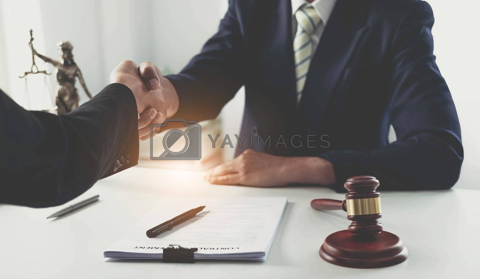 Royalty free image of Handshake after good cooperation, Consultation between a male lawyer and businessman customer, tax and the company of real estate concept. by wichayada