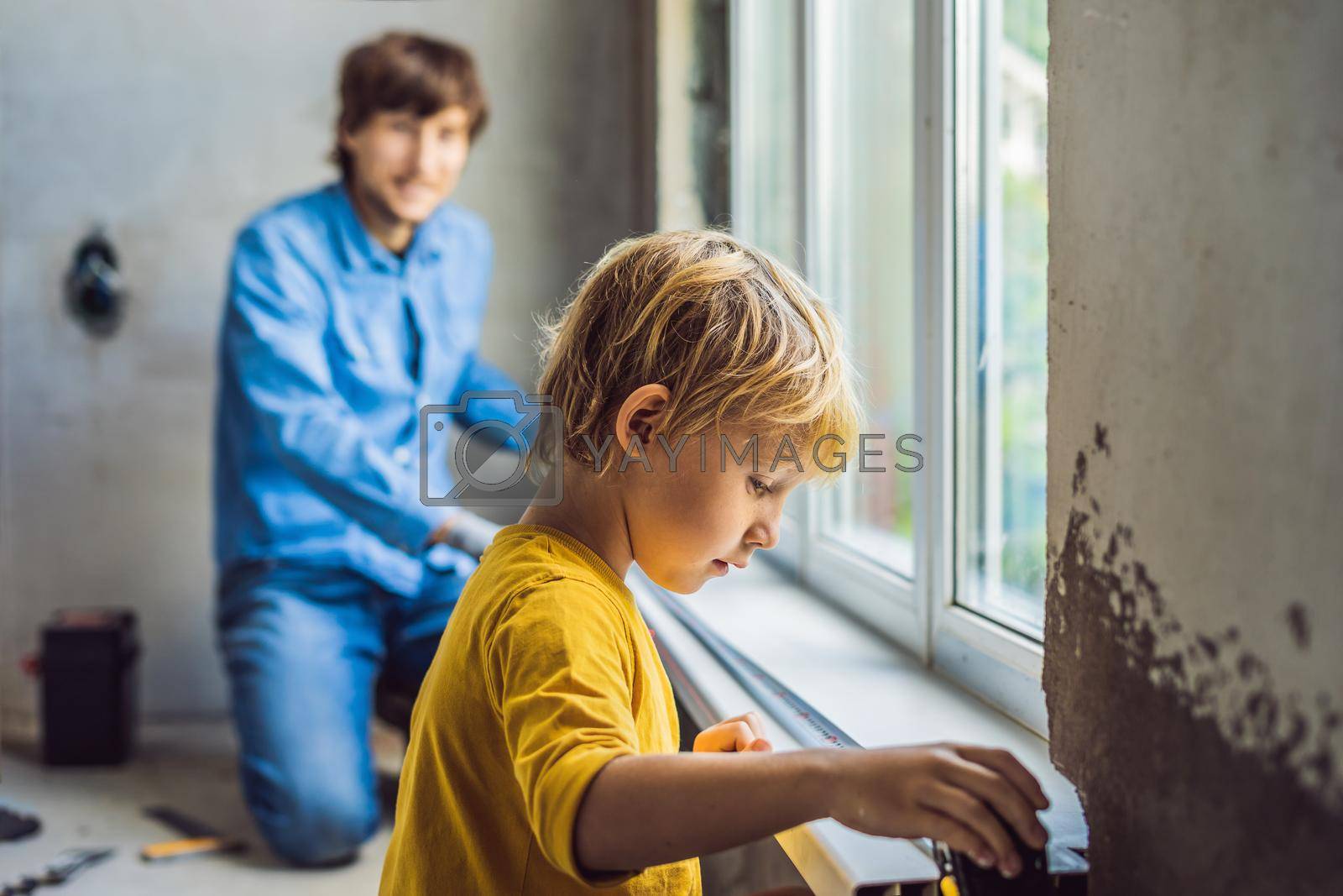 Father and son repair windows together. Repair the house yourself.