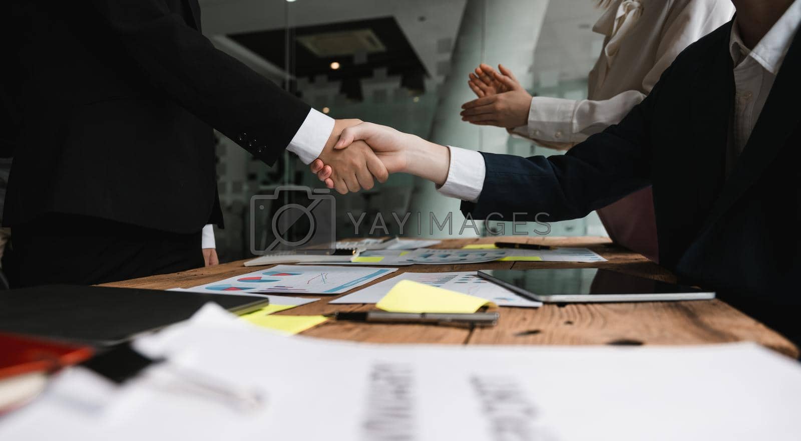 Royalty free image of Business people shaking hands, finishing up meeting, business etiquette, congratulation, merger and acquisition concept by nateemee