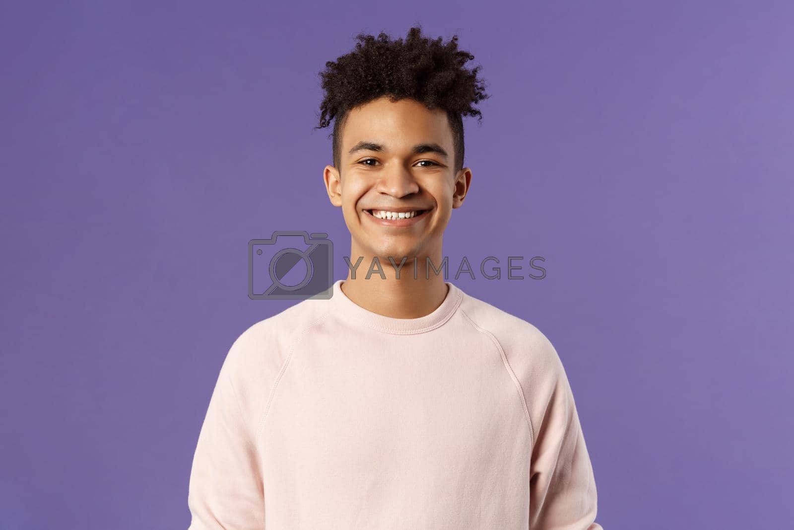 Royalty free image of Close-up portrait of cheerful young hipster guy with dreads, smiling optimistic and delighted, standing purple background, having lucky good day, express positivity and joy by Benzoix