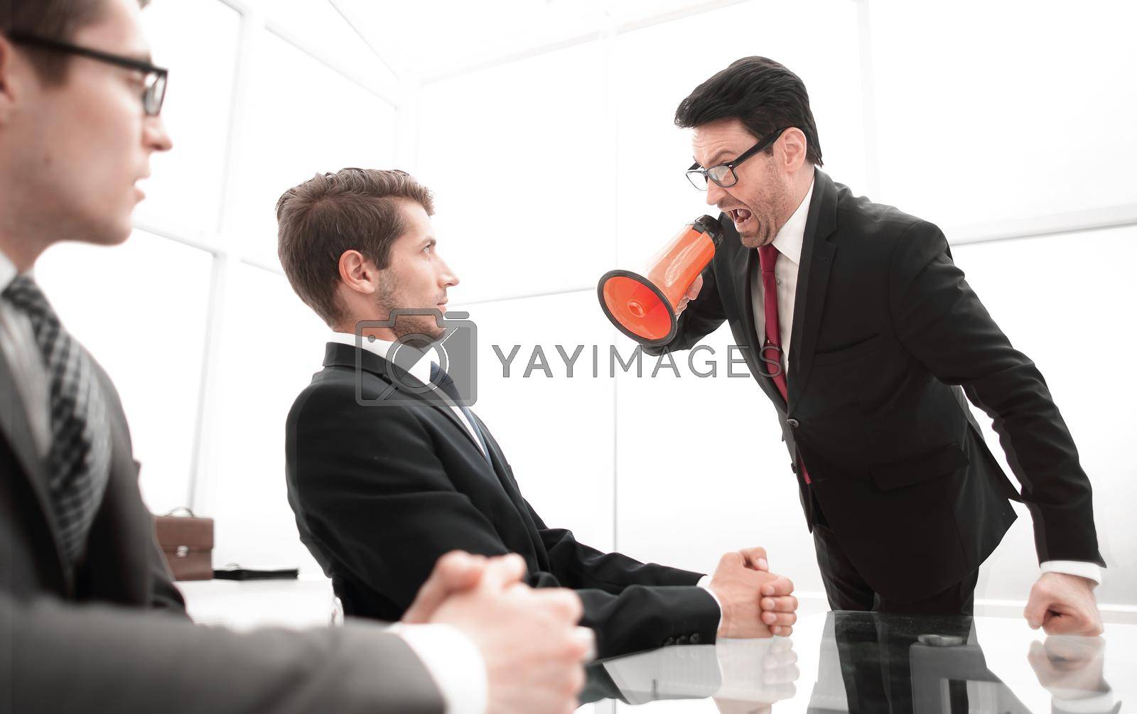 businessman screaming at employee at the time of the meeting.the business metaphor
