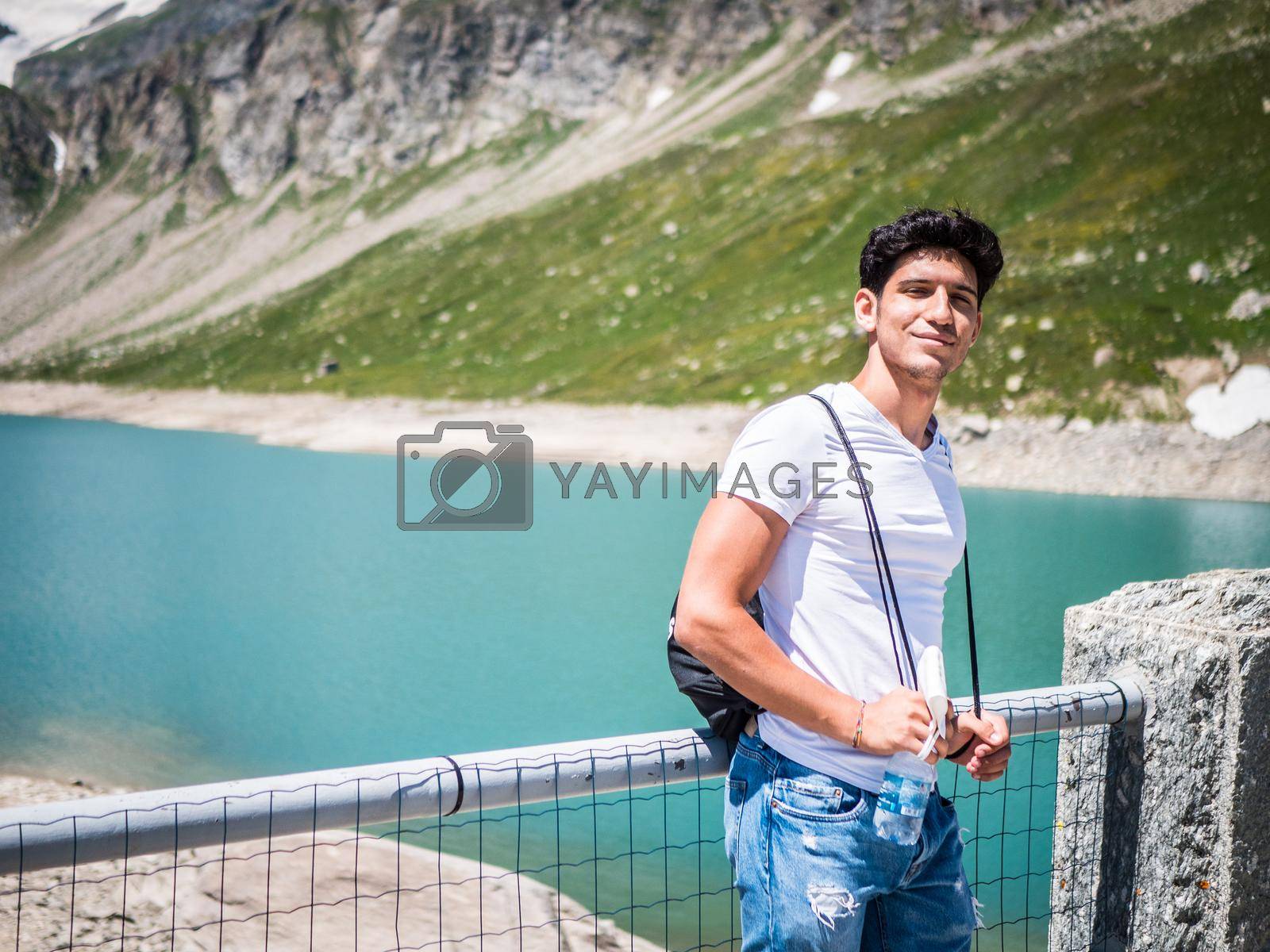 Royalty free image of Handsome young man on a lake in a sunny, peaceful by artofphoto