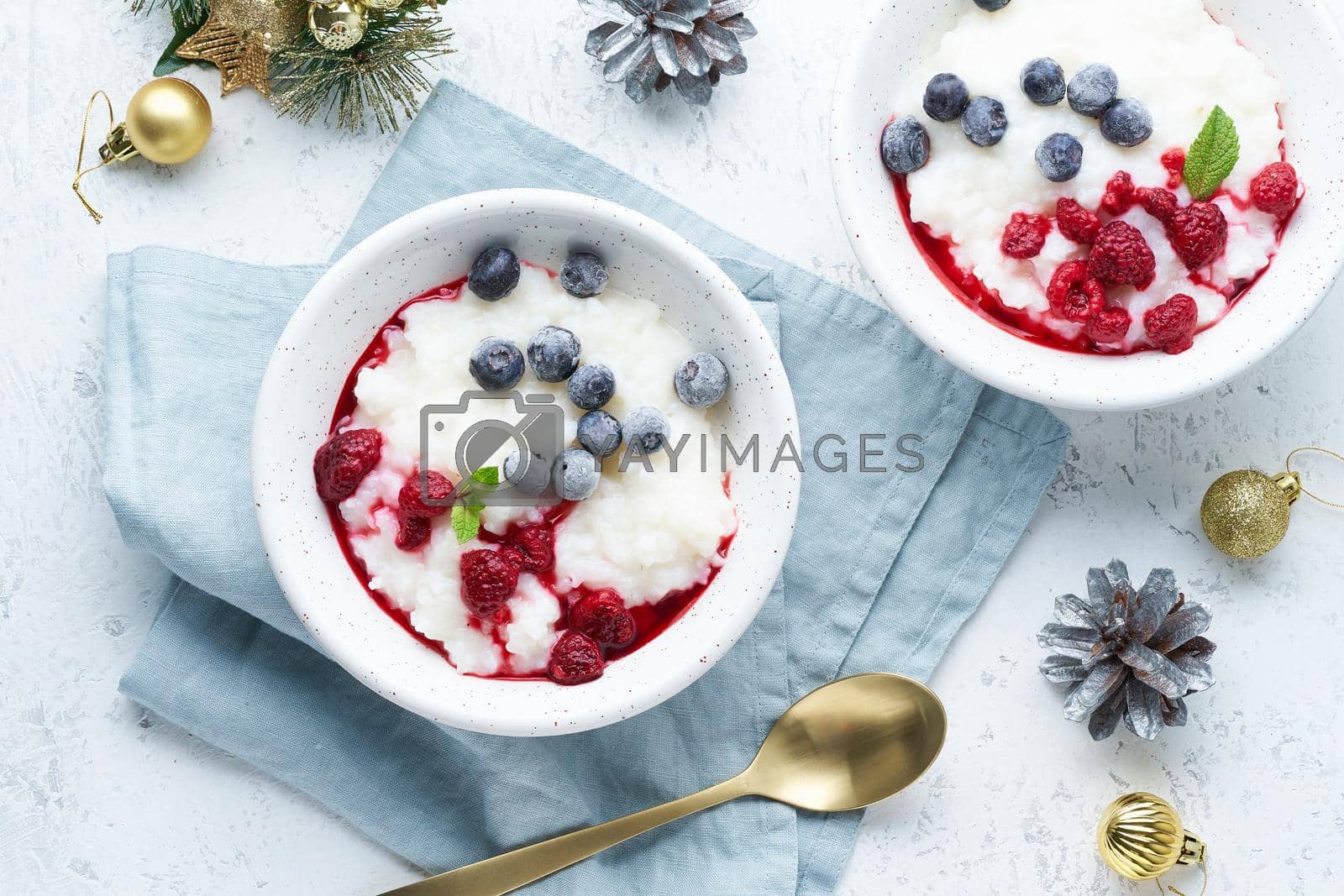Royalty free image of Christmas food, rice pudding, top view. Healthy Vegan diet breakfast with coconut milk by NataBene