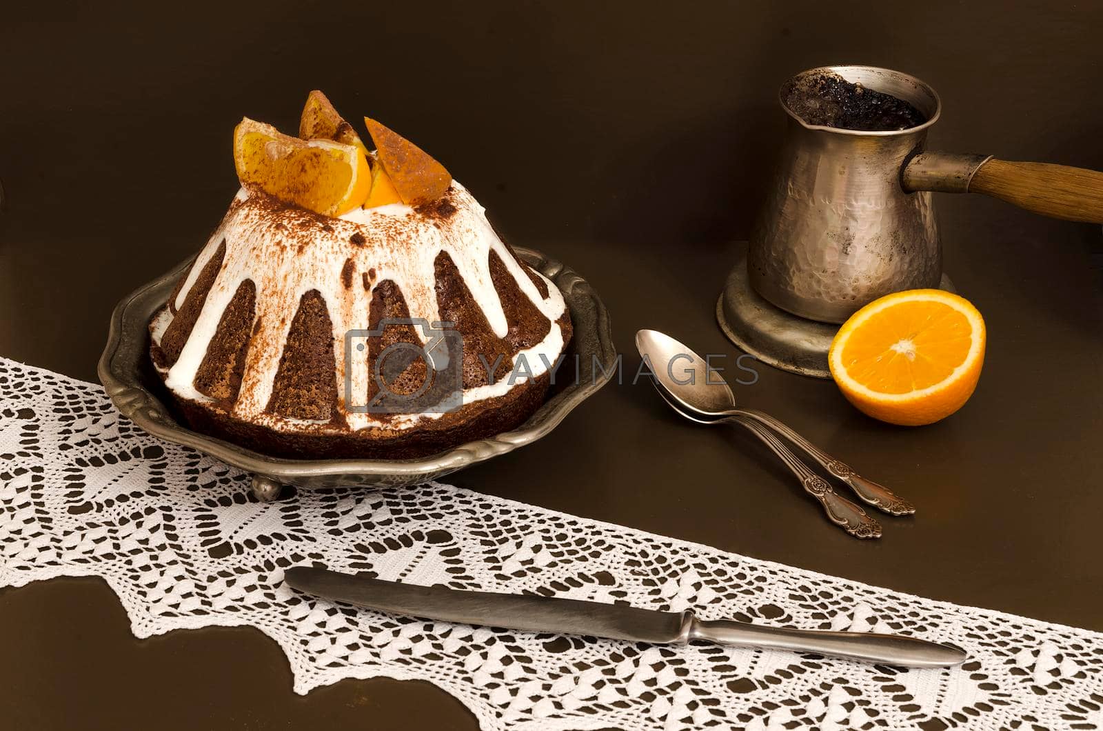 Royalty free image of Chocolate orange cake covered with icing by zimages