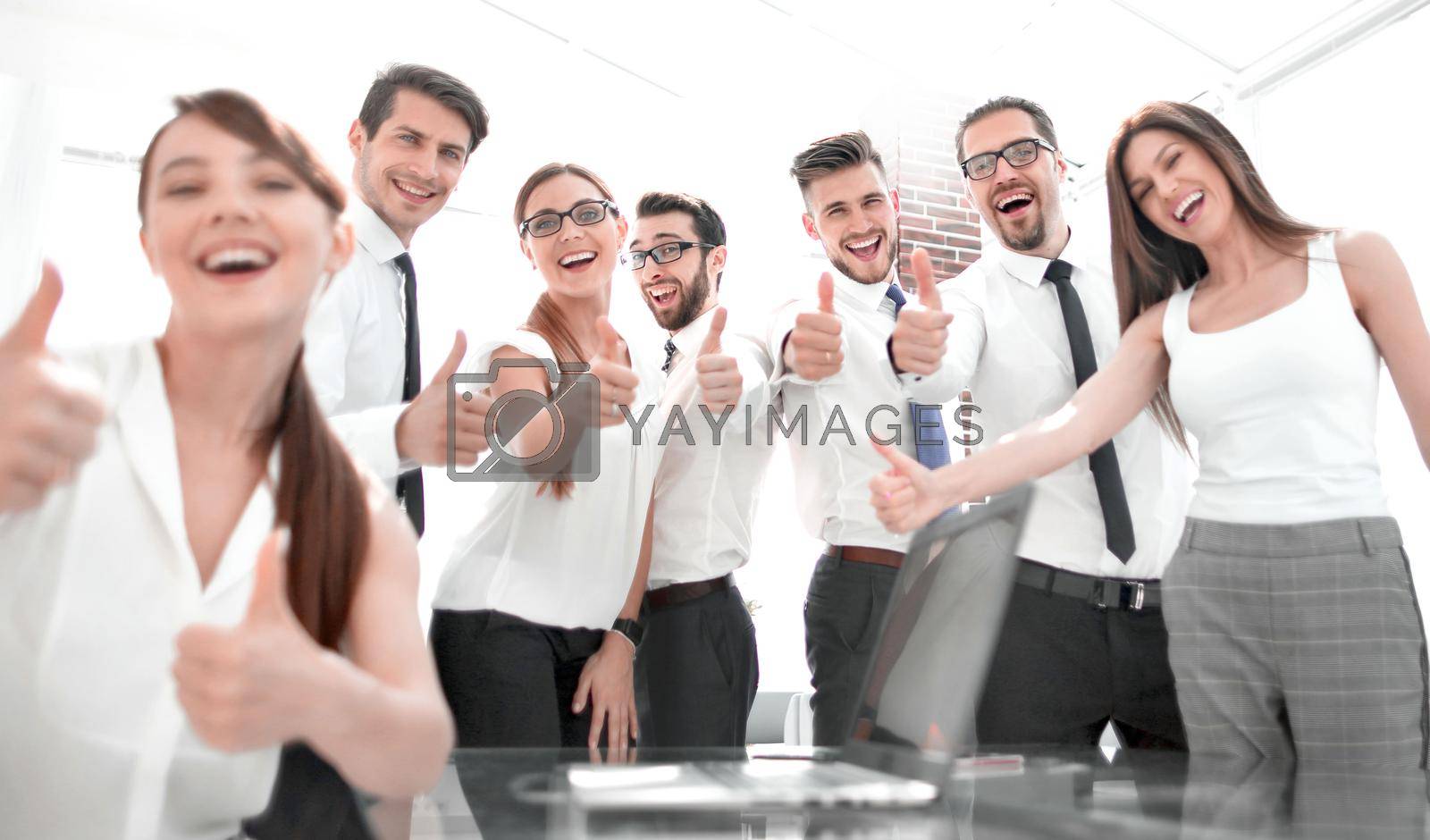 Royalty free image of successful business team showing the thumb up by asdf