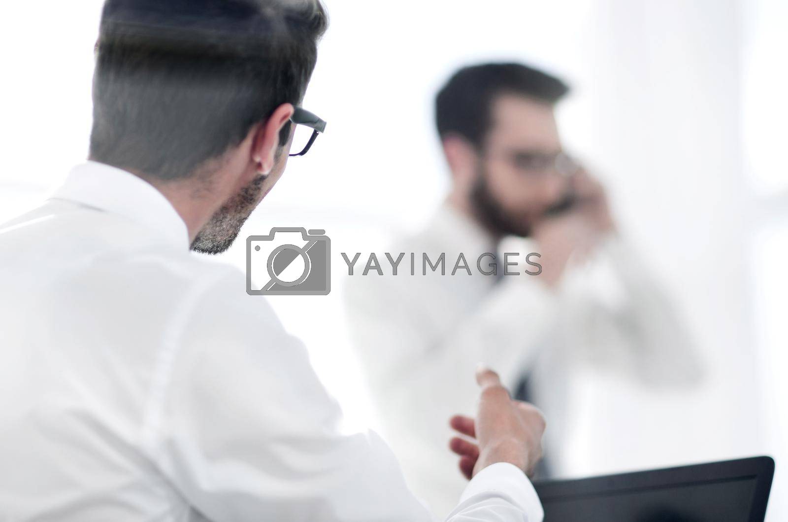 Royalty free image of young businessman showing his success by asdf