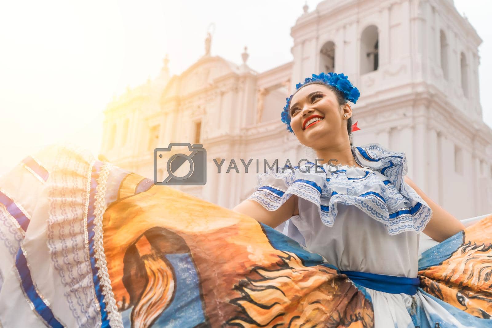 Royalty free image of Traditional dancer with a typical Nicaraguan costume dancing outside the cathedral of Leon Nicaragua celebrating the independence by cfalvarez