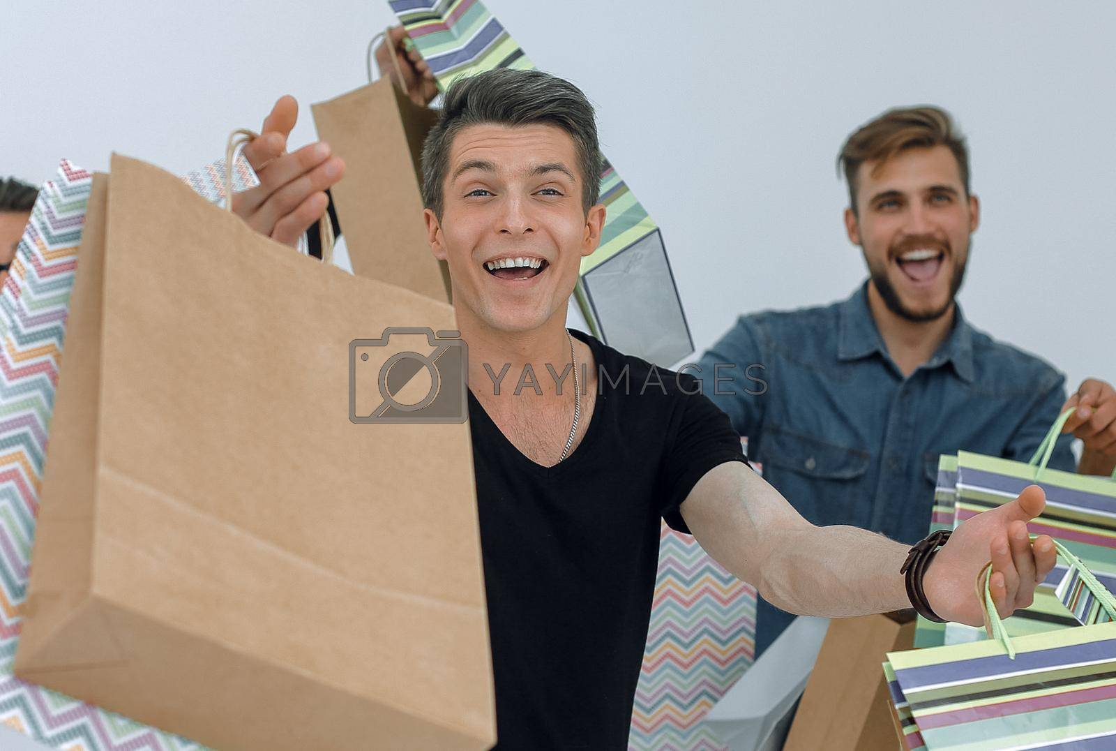 group of cheerful young people with shopping bags.photo with text space