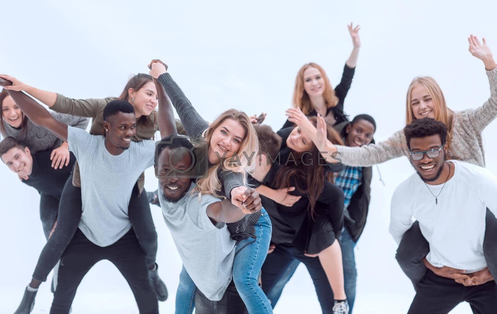 group of diverse fun-loving young people standing together . isolated on a white