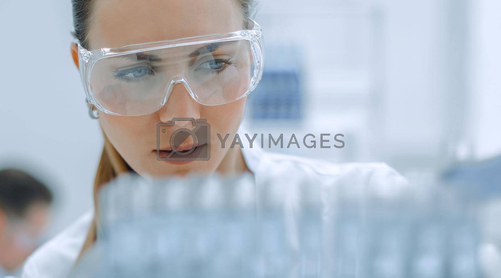 Royalty free image of Test tube in scientist hand in laboratory by asdf