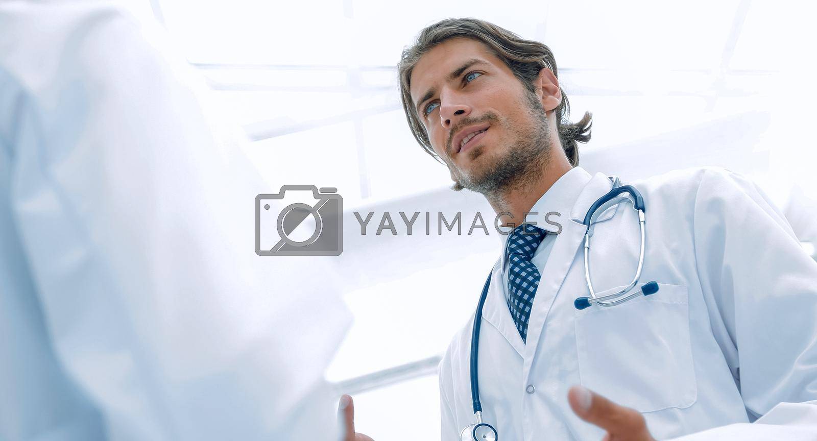 Royalty free image of Two Doctors Having Meeting In Hospital Reception Area by asdf
