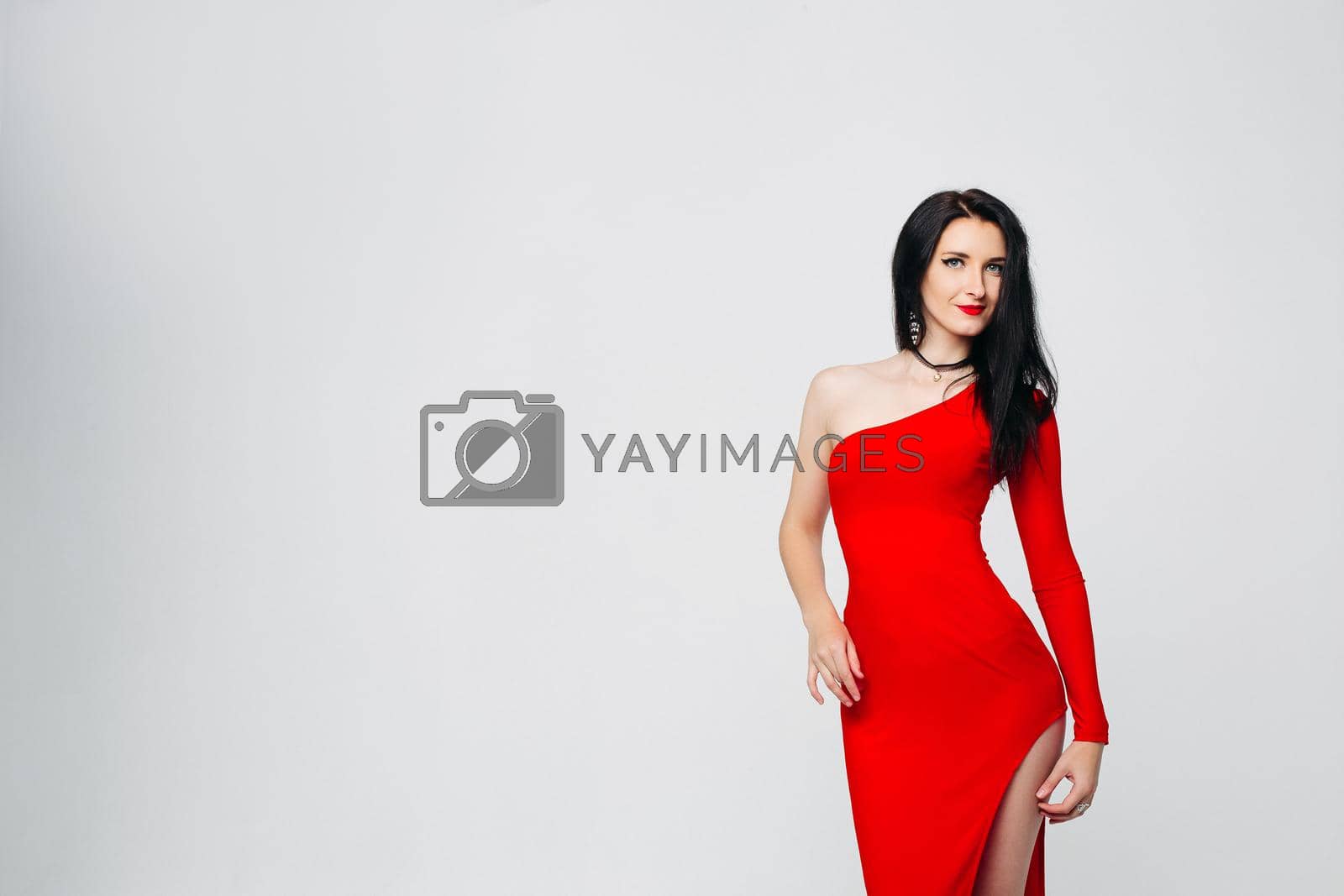 Royalty free image of Sexy and beautiful girl in glamour red dress. by StudioLucky