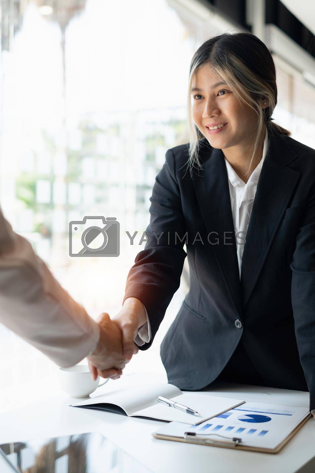 Business people successful negotiation and handshake. celebration partnership and teamwork, business deal concept