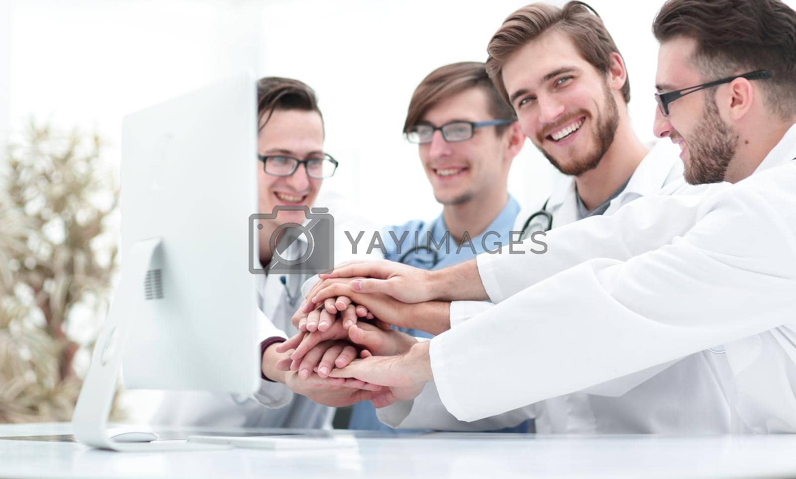 Royalty free image of medical team showing their unity. by asdf