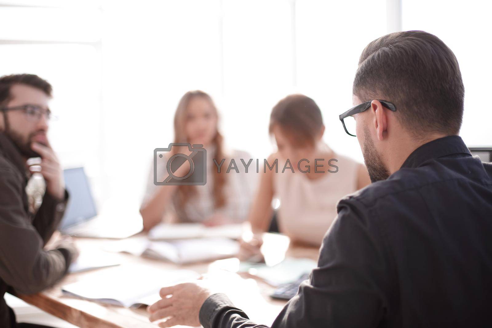 businessman looking at the handshake of business partners. business concept