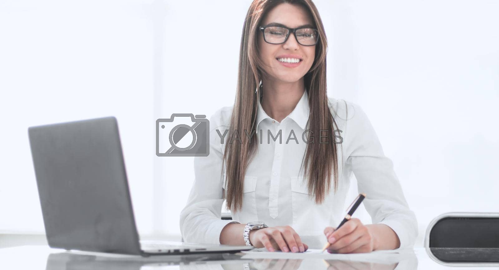 Royalty free image of responsible business woman working with documents by asdf