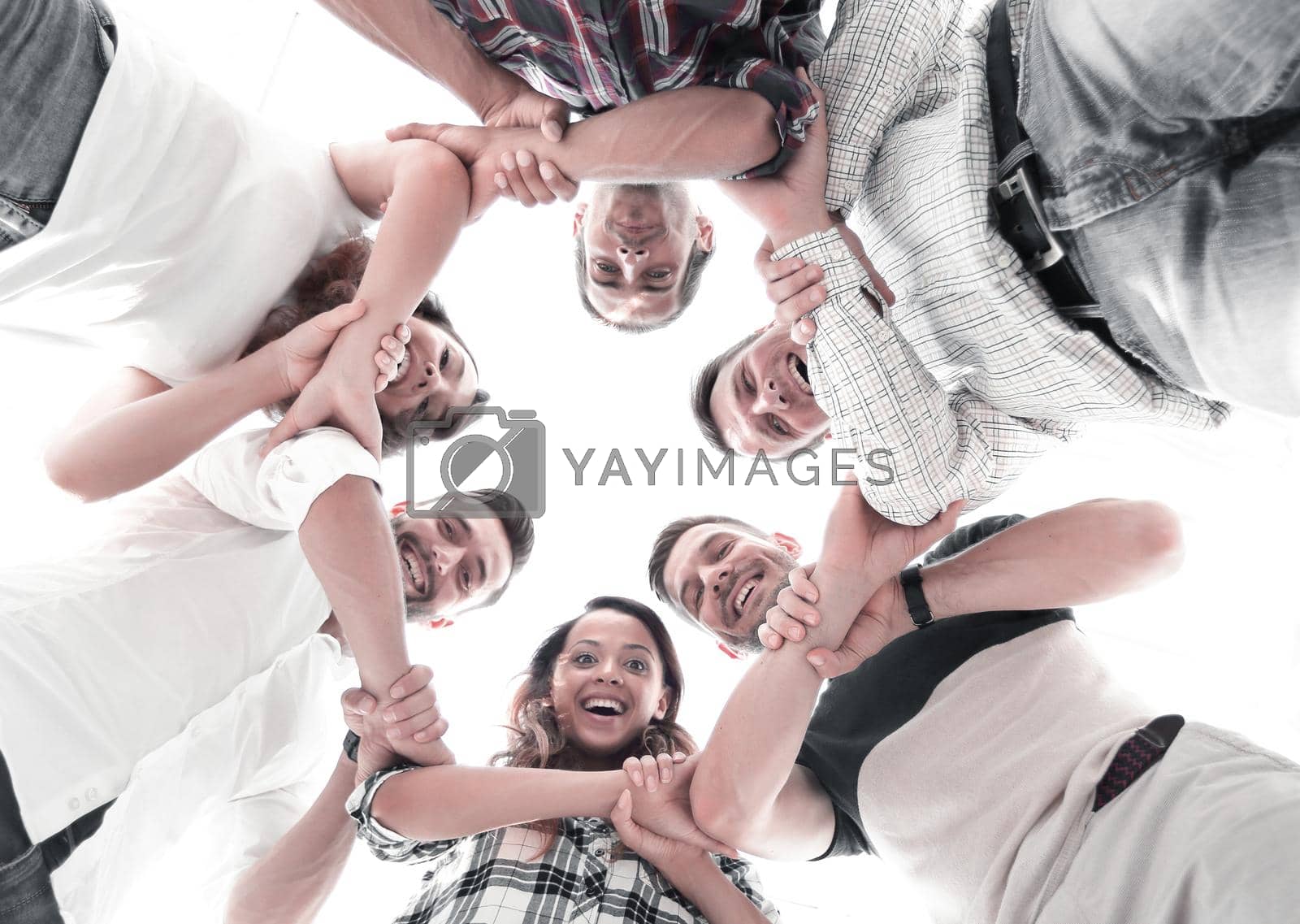 Royalty free image of Happy group of businesspeople stacking their hands in cooperation by asdf